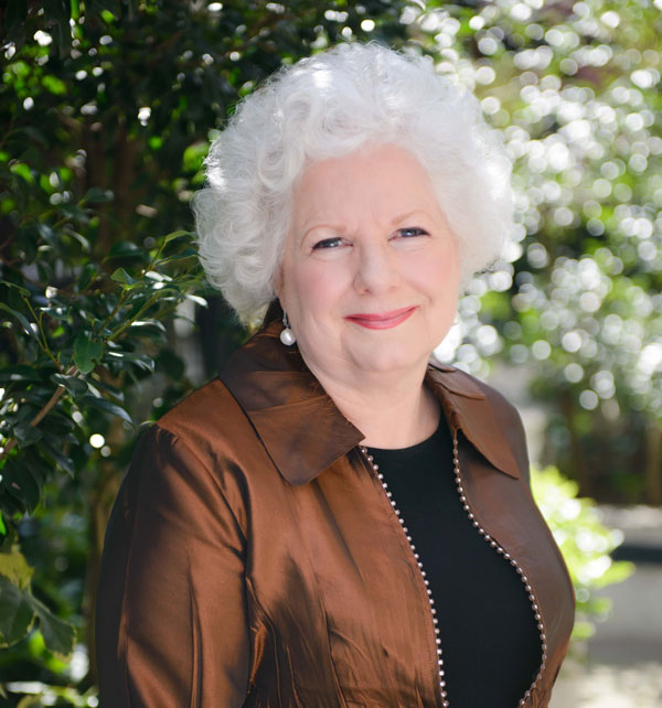 Colleen Bourassa outdoors looking elegant