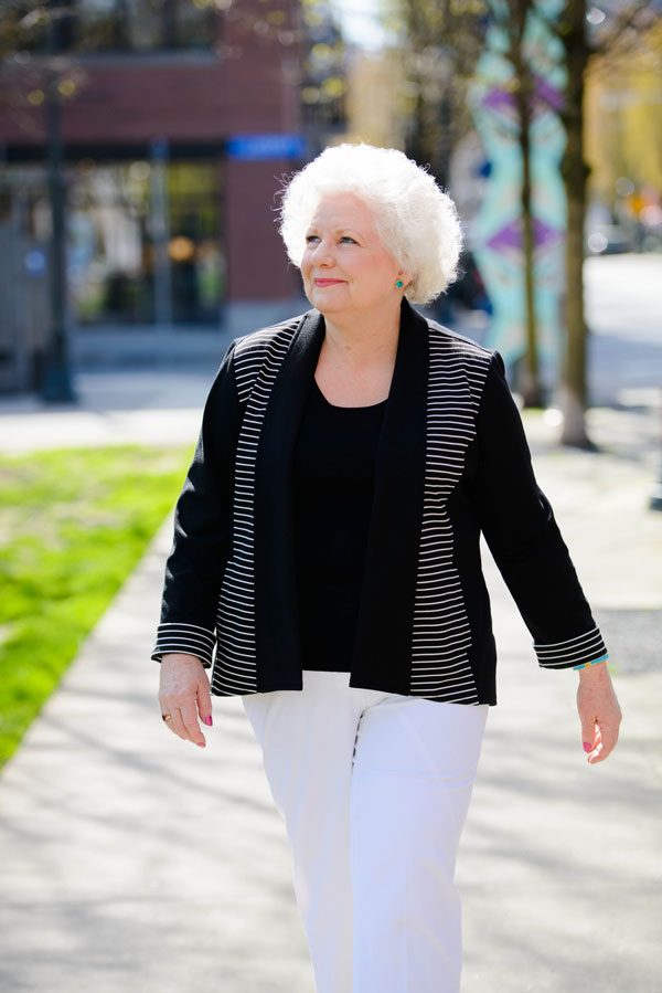 Colleen Bourassa walking confidently in the city
