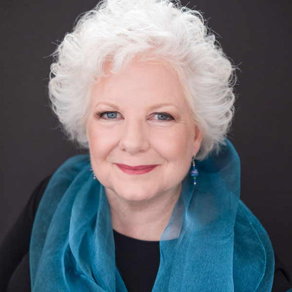 Portrait of Colleen Bourassa smiling warmly